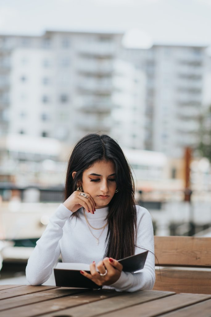 Woman reading personal finance book